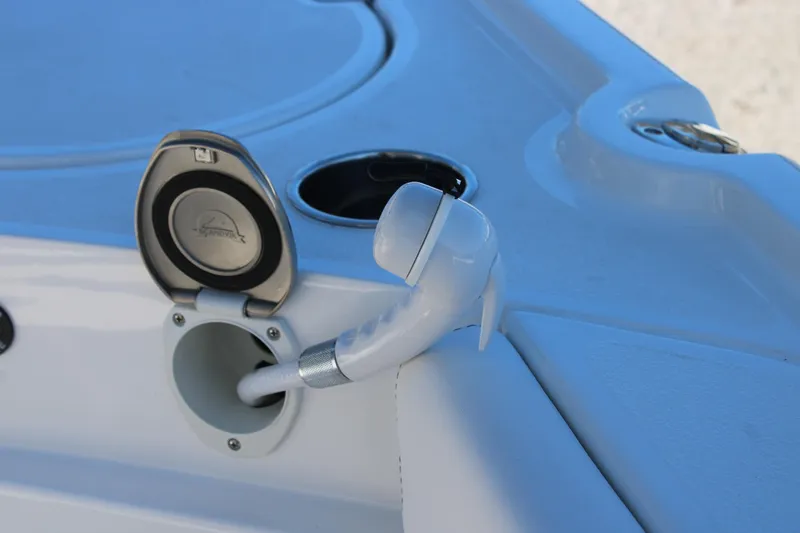 Slide: The Image of 2026 Blazer Bay 2440 boat deck with hose and cup holder. - 22