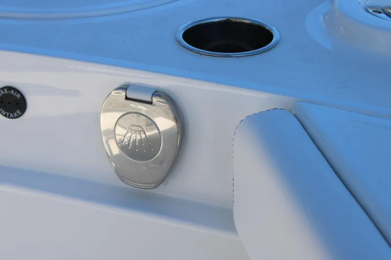 Slide: The Image of 2026 Blazer Bay 2440 boat detail with stainless steel shower cover and cup holder. - 23