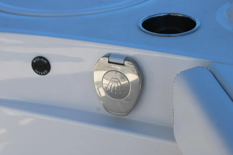 Slide: The Image of 2026 Blazer Bay 2440 boat detail with max-air intake and cup holder. - 24