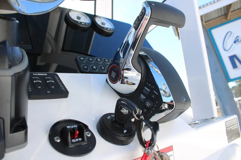 Slide: The Image of Control panel of 2026 Blazer Bay 2440 boat with throttle and ignition keys. - 31