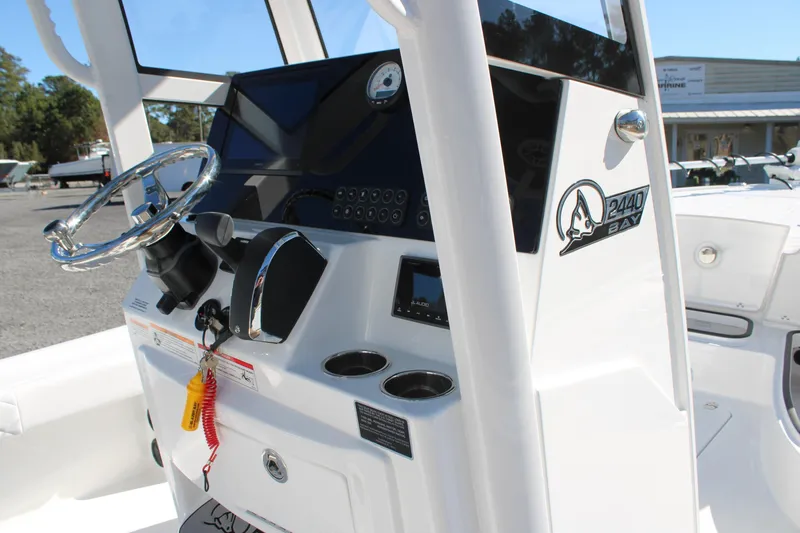 Slide: The Image of 2026 Blazer Bay 2440 boat console with steering wheel and controls. - 33