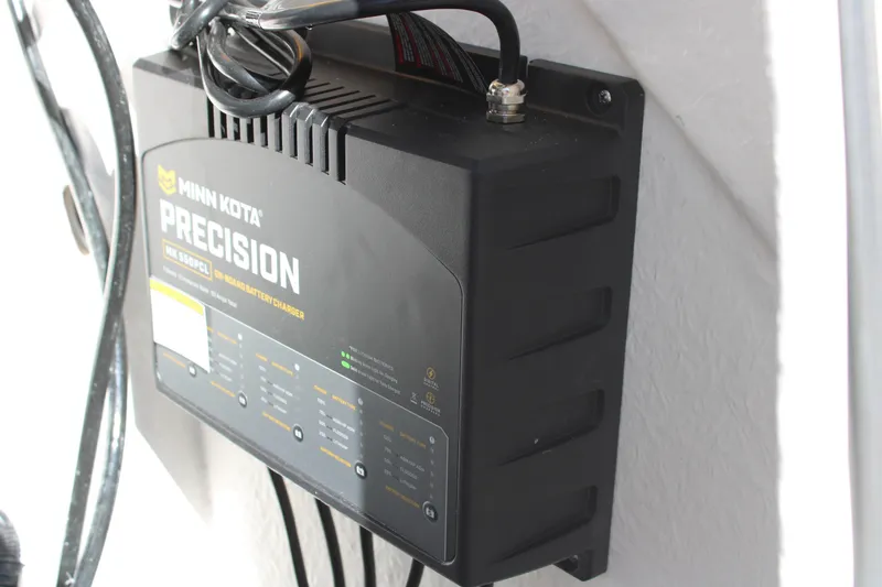 Slide: The Image of Minn Kota Precision onboard battery charger mounted on Blazer Bay 2440, 2026 model. - 36