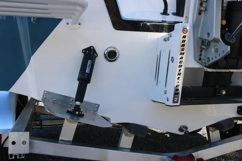 Slide: The Image of 2026 Blazer Bay 2440 boat transom with hydraulic components and mounting hardware. - 60