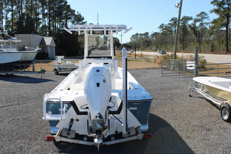 Slide: The Image of 2026 Blazer Bay 2440 boat displayed outdoors on gravel lot. - 64