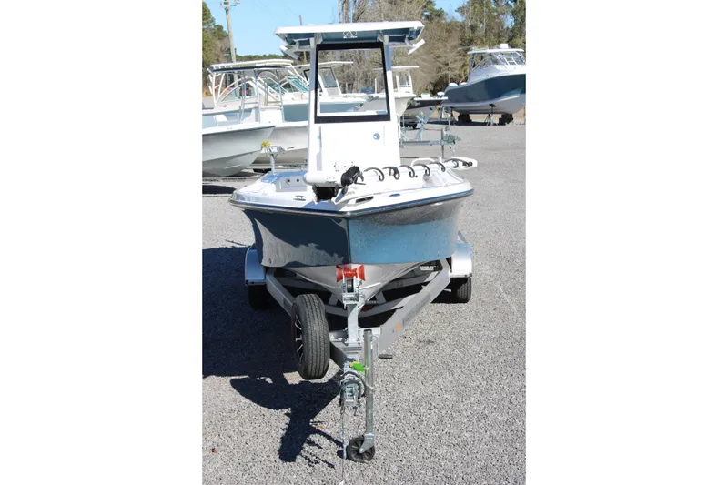 Slide: The Image of 2026 Blazer Bay 2440 boat on trailer in outdoor setting. - 68