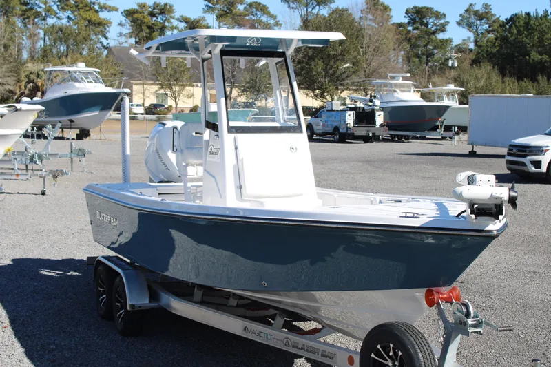 Slide: The Image of 2026 Blazer Bay 2440 boat on trailer in outdoor showroom. - 69