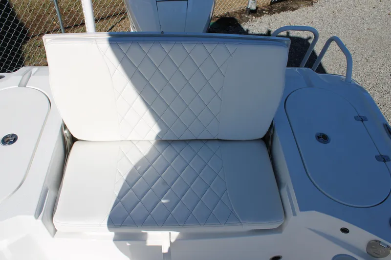 Slide: The Image of White cushioned seating on 2026 Blazer Bay 2440 boat, featuring diamond stitching. - 8
