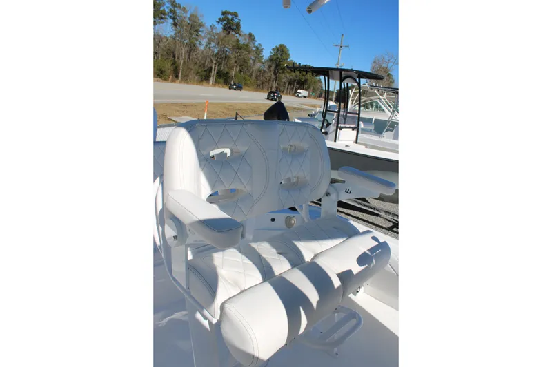 Slide: The Image of Luxurious white seating on 2026 Blazer Bay 2440 boat, featuring diamond stitching and armrests. - 9