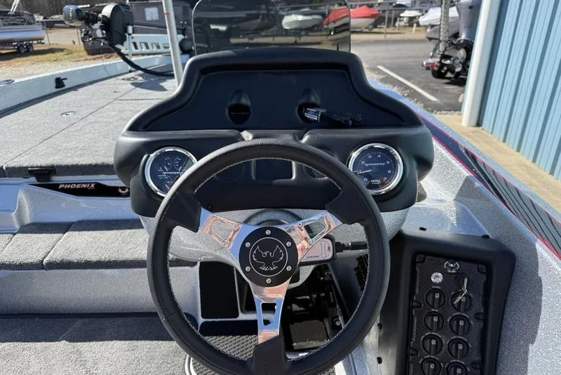 Slide: The Image of Open storage compartment in 2026 Phoenix 818 Pro boat interior. - 16