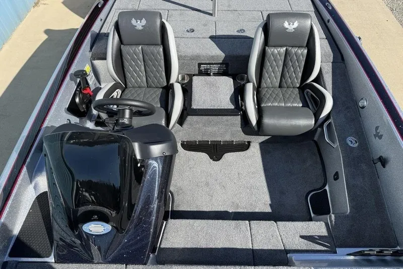 Slide: The Image of 2026 Phoenix 818 Pro boat showing open storage compartment and engine details. - 18