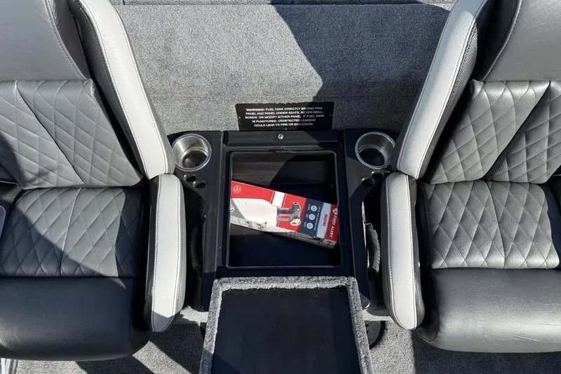 Slide: The Image of 2026 Phoenix 818 Pro boat deck with gray carpet and storage compartments. - 22