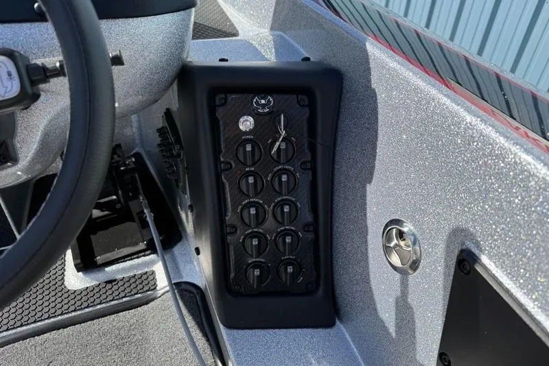 Slide: The Image of 2026 Phoenix 818 Pro boat with spacious deck and seating, parked outdoors. - 25