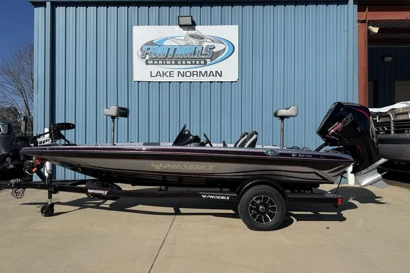 Slide: The Image of 2026 Phoenix 818 Pro boat on trailer, sleek design, parked outdoors. - 3
