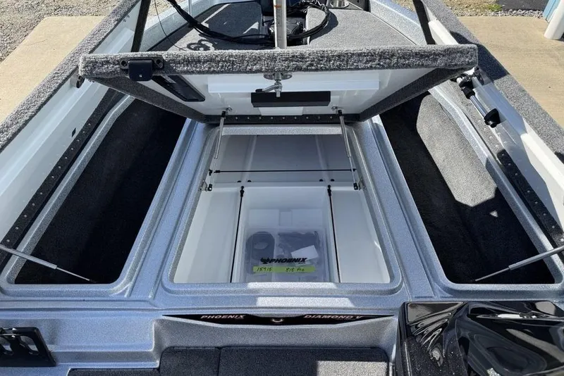 Slide: The Image of 2026 Phoenix 818 Pro boat deck with gray carpet and storage compartments. - 7