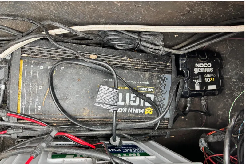 Slide: The Image of 2004 Triton Tr-20XDC boat battery compartment with NOCO Genius GenPro 10X1 charger. - 10