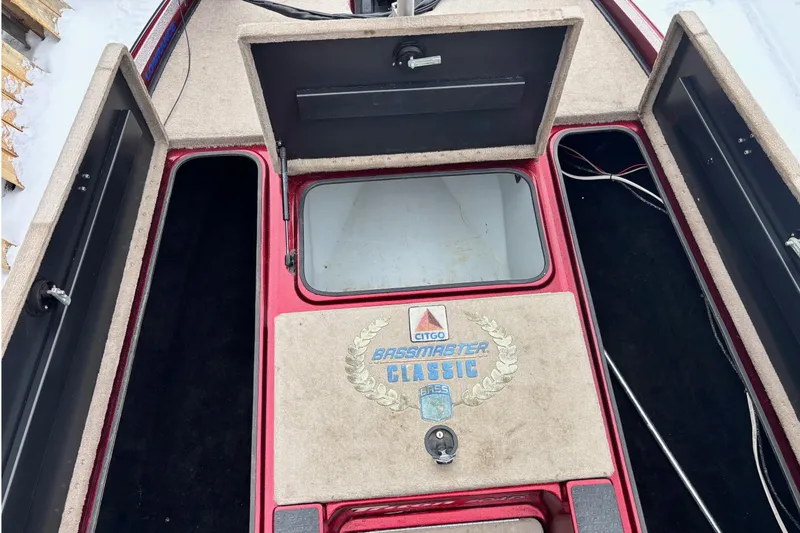Slide: The Image of 2004 Triton Tr-20XDC boat interior with storage compartments and Bassmaster Classic logo. - 14