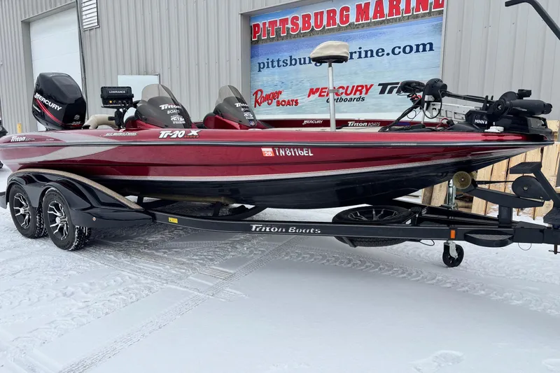 Slide: The Image of 2004 Triton Tr-20XDC boat on trailer, parked in snowy area near Pittsburg Marine. - 5