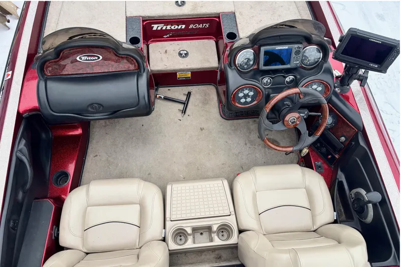 Slide: The Image of 2004 Triton Tr-20XDC boat interior with dual seats, steering wheel, and control panel. - 7