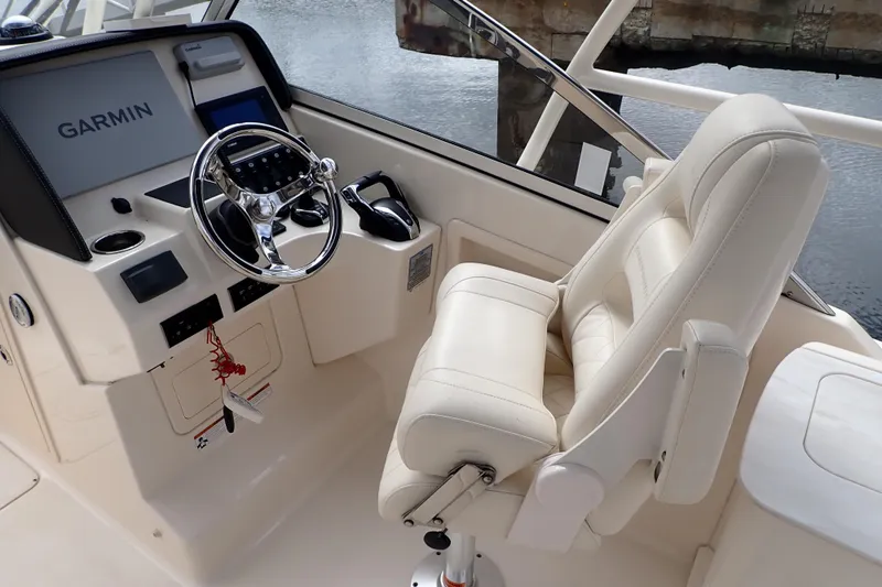 Slide: The Image of 2021 Grady-White Freedom 275 helm with Garmin navigation and luxurious captain's chair. - 14