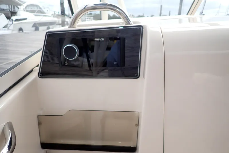 Slide: The Image of 2021 Grady-White Freedom 275 boat dashboard with Fusion audio system. - 20
