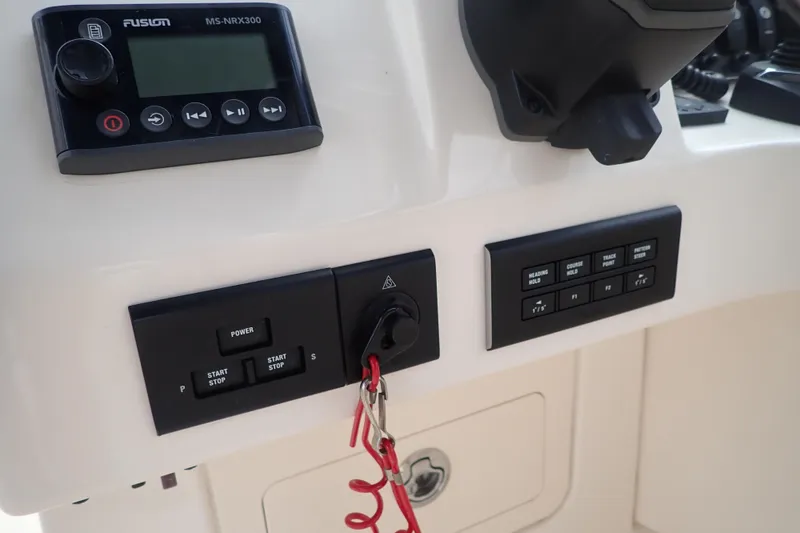 Slide: The Image of Control panel of 2021 Grady-White Freedom 275 boat with Fusion MS-NRX300 system. - 21