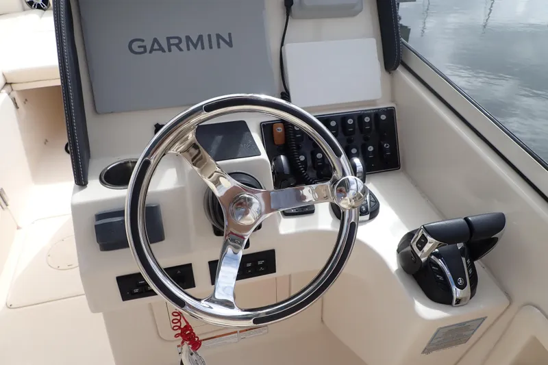 Slide: The Image of 2021 Grady-White Freedom 275 boat helm with Garmin navigation system. - 24