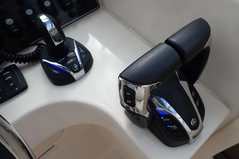 Slide: The Image of 2021 Grady-White Freedom 275 boat controls with modern throttle and joystick system. - 25