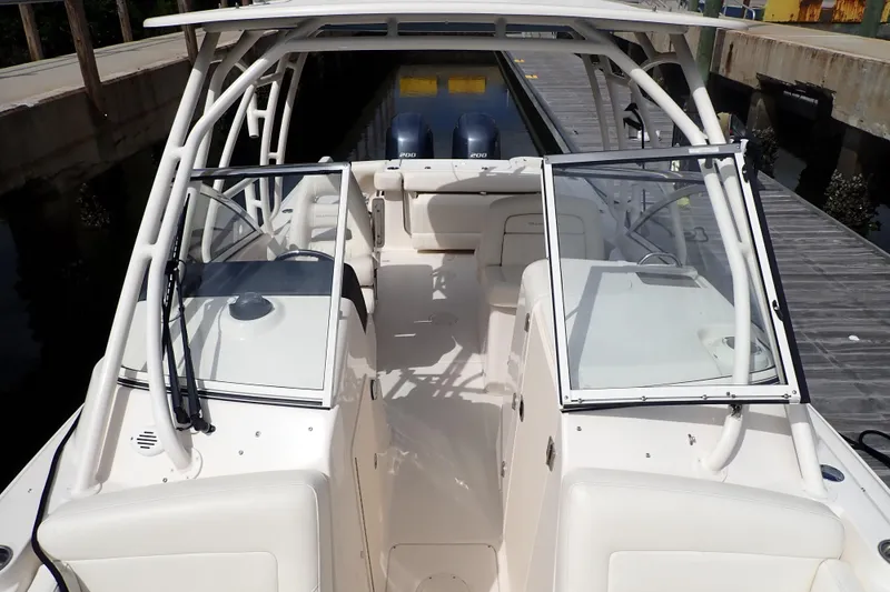 Slide: The Image of 2021 Grady-White Freedom 275 boat interior with dual consoles and seating. - 30