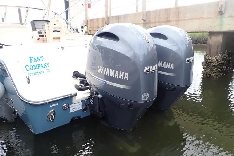 Slide: The Image of 2021 Grady-White Freedom 275 boat with twin Yamaha 200 engines docked in water. - 48