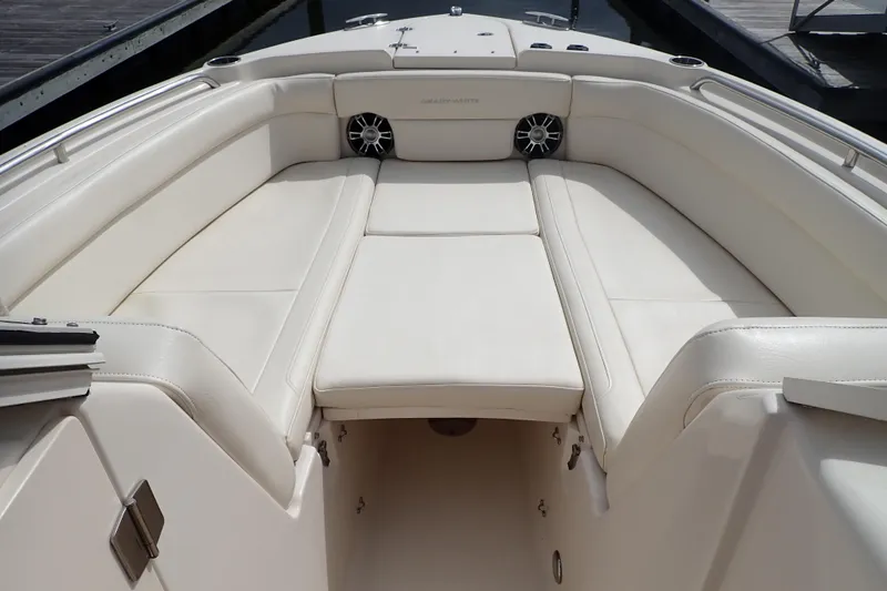 Slide: The Image of 2021 Grady-White Freedom 275 boat interior with white cushioned seating. - 5