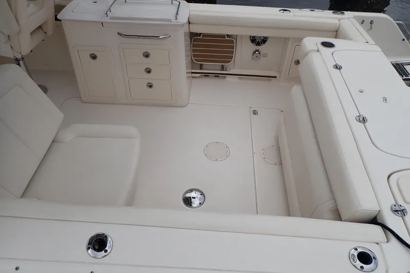Slide: The Image of 2021 Grady-White Freedom 275 boat interior with seating and storage compartments. - 8