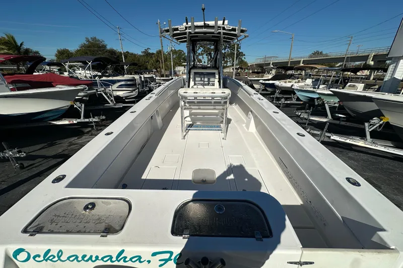 Slide: The Image of 2005 Contender 36 Cuddy boat in Ocklawaha, Florida, docked among other vessels. - 12