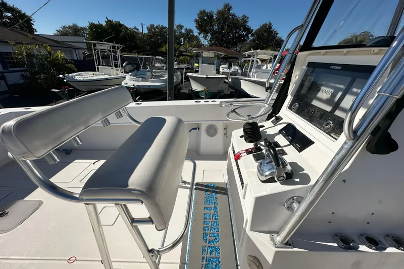 Slide: The Image of 2005 Contender 36 Cuddy boat cockpit with helm controls and seating. - 20