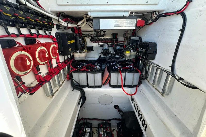 Slide: The Image of Electrical system of a 2005 Contender 36 Cuddy boat, featuring batteries and wiring. - 32