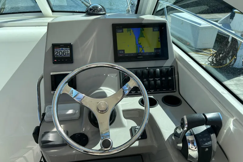 Slide: The Image of Helm of 2015 Boston Whaler 285 Conquest with navigation and control systems. - 7