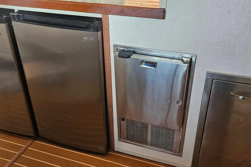 Slide: The Image of Stainless steel appliances in 1988 Cheoy Lee 51 Long Range Cockpit Motor Yacht interior. - 10