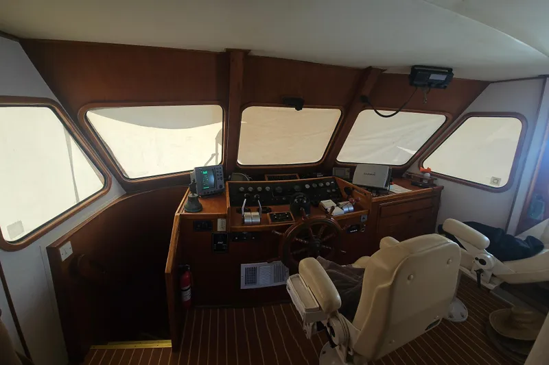 Slide: The Image of Interior helm of 1988 Cheoy Lee 51 Long Range Cockpit Motor Yacht with navigation equipment. - 12
