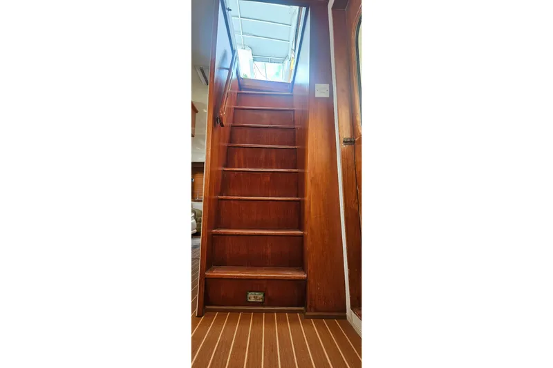 Slide: The Image of Wooden staircase inside 1988 Cheoy Lee 51 Long Range Cockpit Motor Yacht. - 17