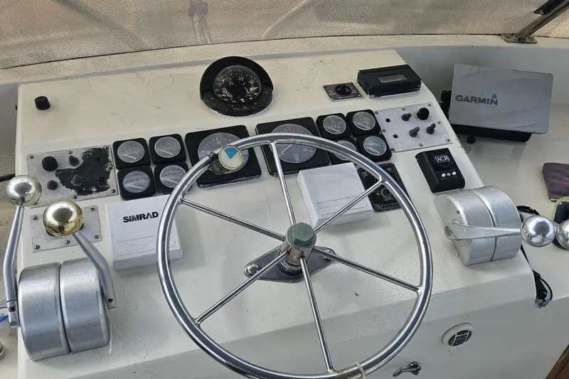 Slide: The Image of Cockpit controls of 1988 Cheoy Lee 51 Long Range Motor Yacht with navigation instruments. - 20