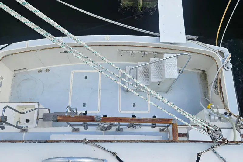 Slide: The Image of 1988 Cheoy Lee 51 Long Range Cockpit Motor Yacht deck view with ropes and steps. - 4