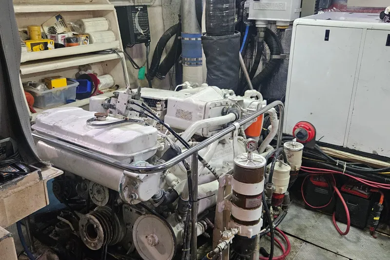 Slide: The Image of Engine room of 1988 Cheoy Lee 51 Long Range Cockpit Motor Yacht, showcasing machinery and equipment. - 45