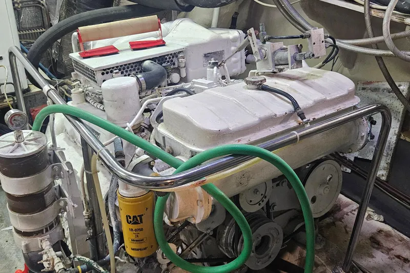 Slide: The Image of Engine room of 1988 Cheoy Lee 51 Long Range Cockpit Motor Yacht, featuring Caterpillar components. - 46