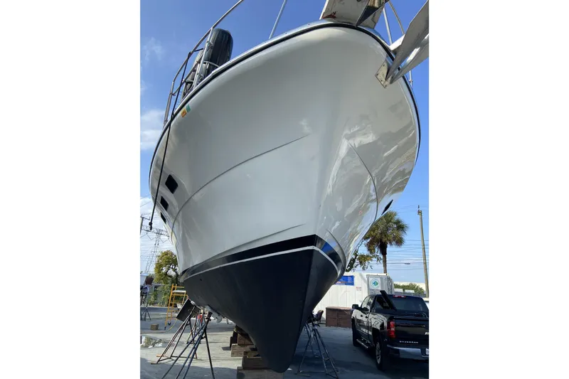 Slide: The Image of 1988 Cheoy Lee 51 Long Range Cockpit Motor Yacht on dry dock, side view. - 52