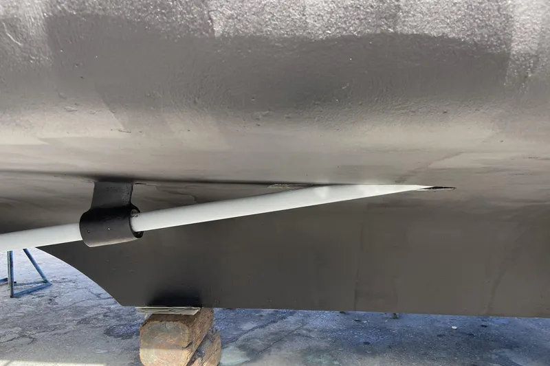 Slide: The Image of 1988 Cheoy Lee 51 Long Range Cockpit Motor Yacht hull detail with propeller shaft. - 53