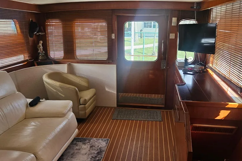 Slide: The Image of Luxurious interior of 1988 Cheoy Lee 51 Long Range Cockpit Motor Yacht with leather seating. - 7