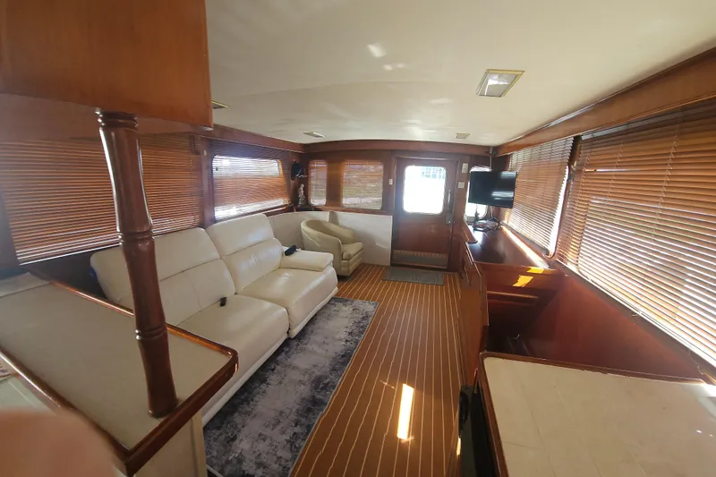Slide: The Image of Interior of 1988 Cheoy Lee 51 Long Range Cockpit Motor Yacht with elegant wood finishes. - 8