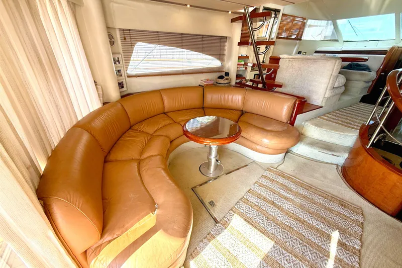 Slide: The Image of Luxurious interior of 2000 Fairline Squadron 55 yacht with leather seating and wooden accents. - 5