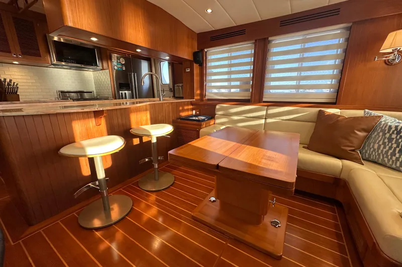 Slide: The Image of Luxurious 2017 Kadey-Krogen 58EB yacht interior with modern kitchen and cozy seating area. - 10
