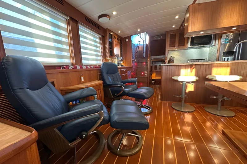 Slide: The Image of Luxurious interior of 2017 Kadey-Krogen 58EB yacht with leather seating and modern kitchen. - 12