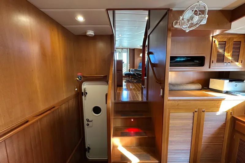 Slide: The Image of Interior of 2017 Kadey-Krogen 58EB yacht with wooden stairs and cabinetry. - 30